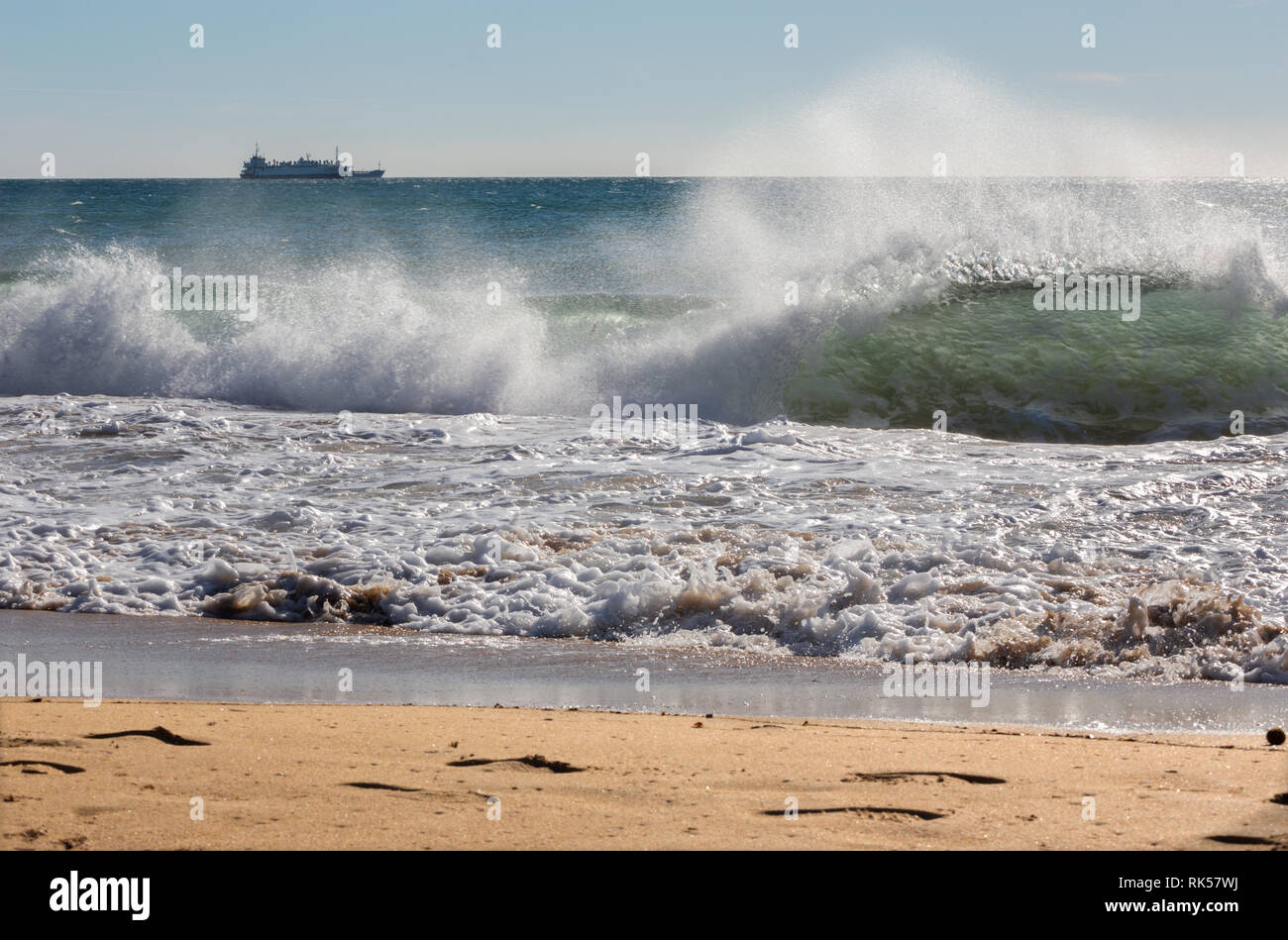 Palma de Mallorca - The big wave and the cargo in background. Stock Photo