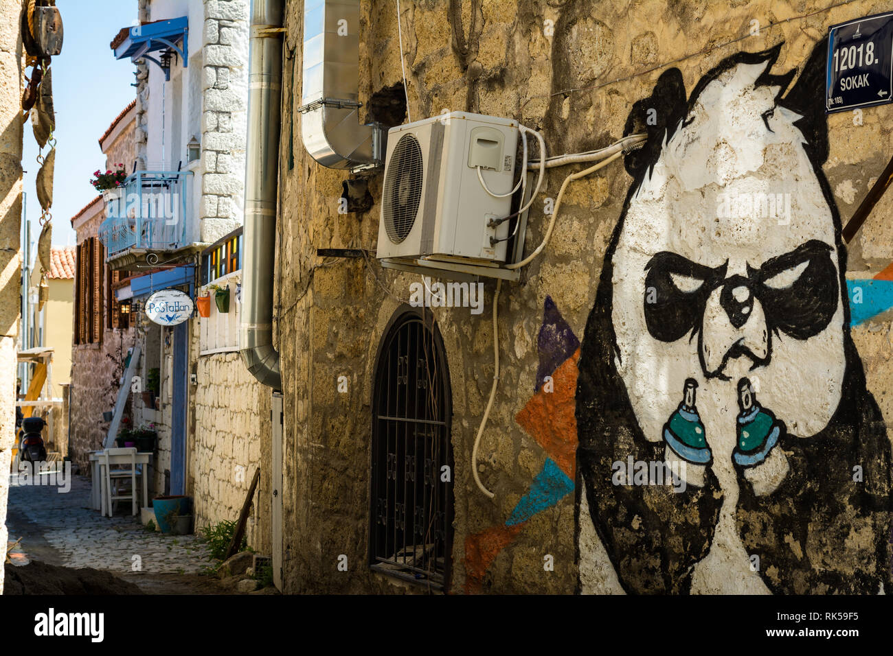 Alacati, Turkey -March 30, 2016- Street art wall painting of a panda Stock Photo
