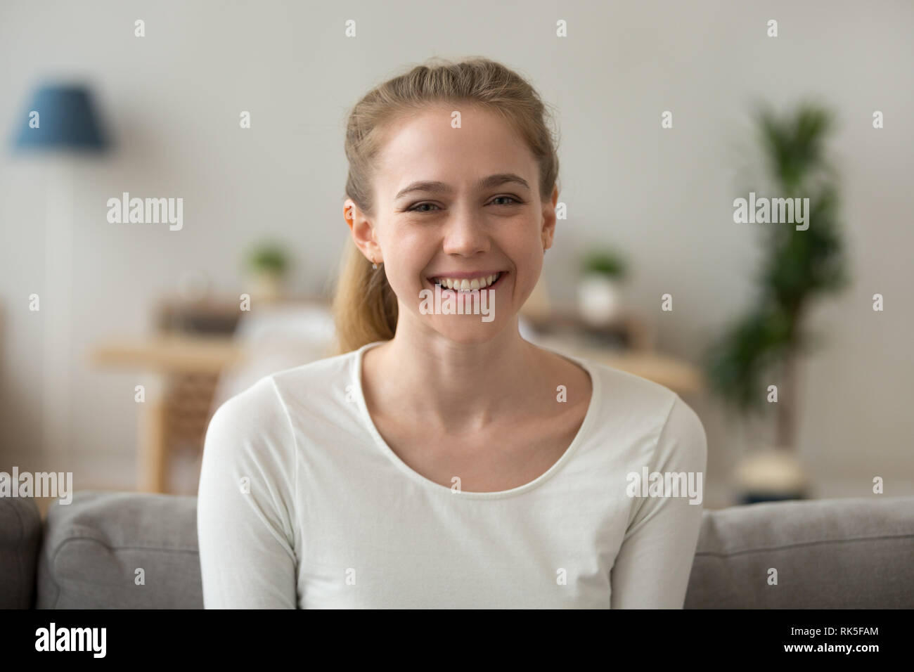 Happy friendly casual teen girl looking at camera, headshot portrait Stock Photo