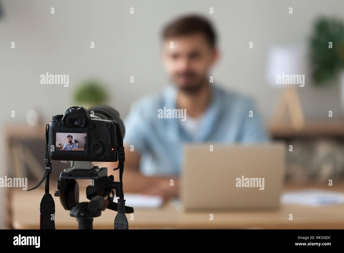 Digital camera filming commercial vlog of man teacher vlogger coach Stock Photo