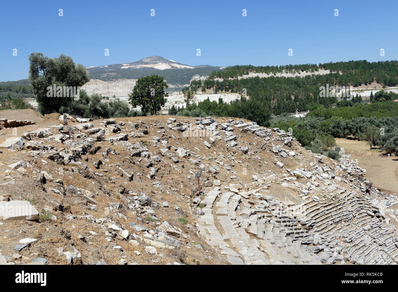 Cavea (seating) of the Hellenistic theatre, built on a natural slope of a hill, ancient Stratonicea, Eskihisar, Turkey. The theatre is of Greek type w Stock Photo