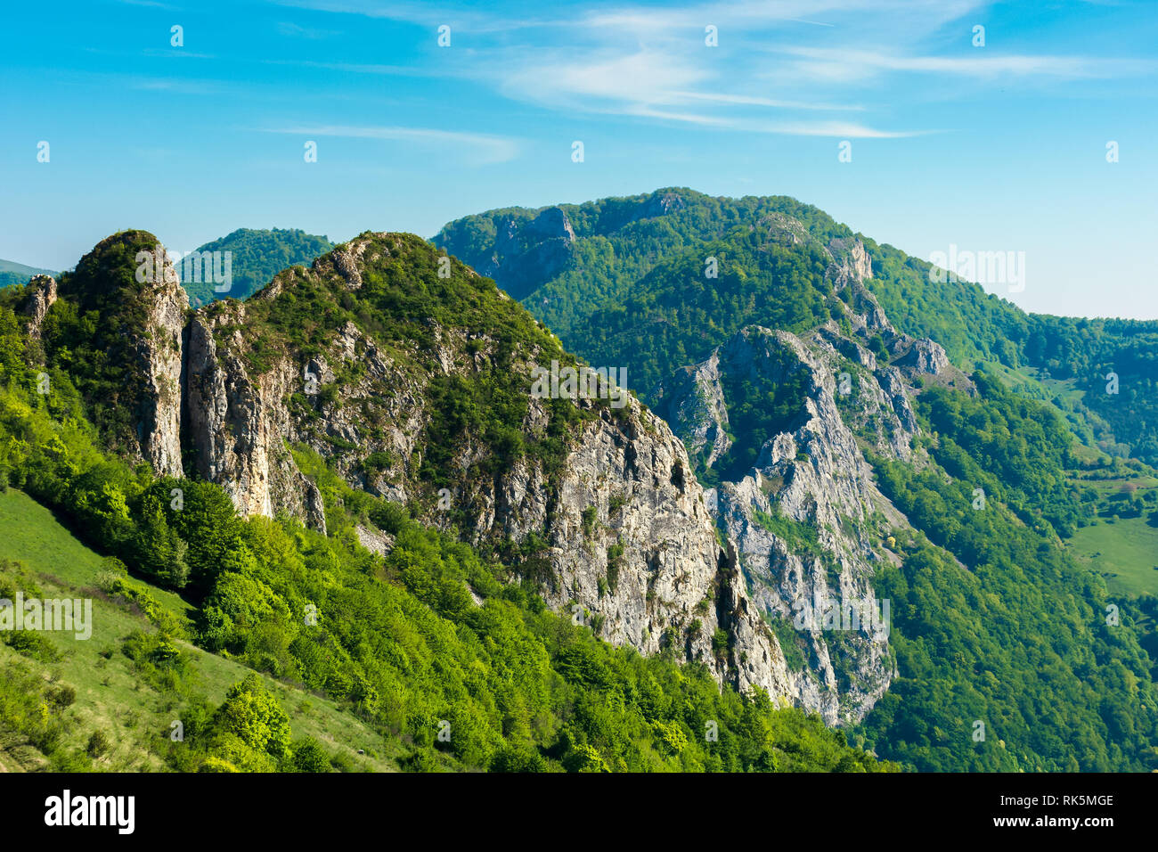 beautiful landscape of romania mountains. forested hills and huge cliffs of canyon. wonderful nature scenery. sunny weather in springtime Stock Photo