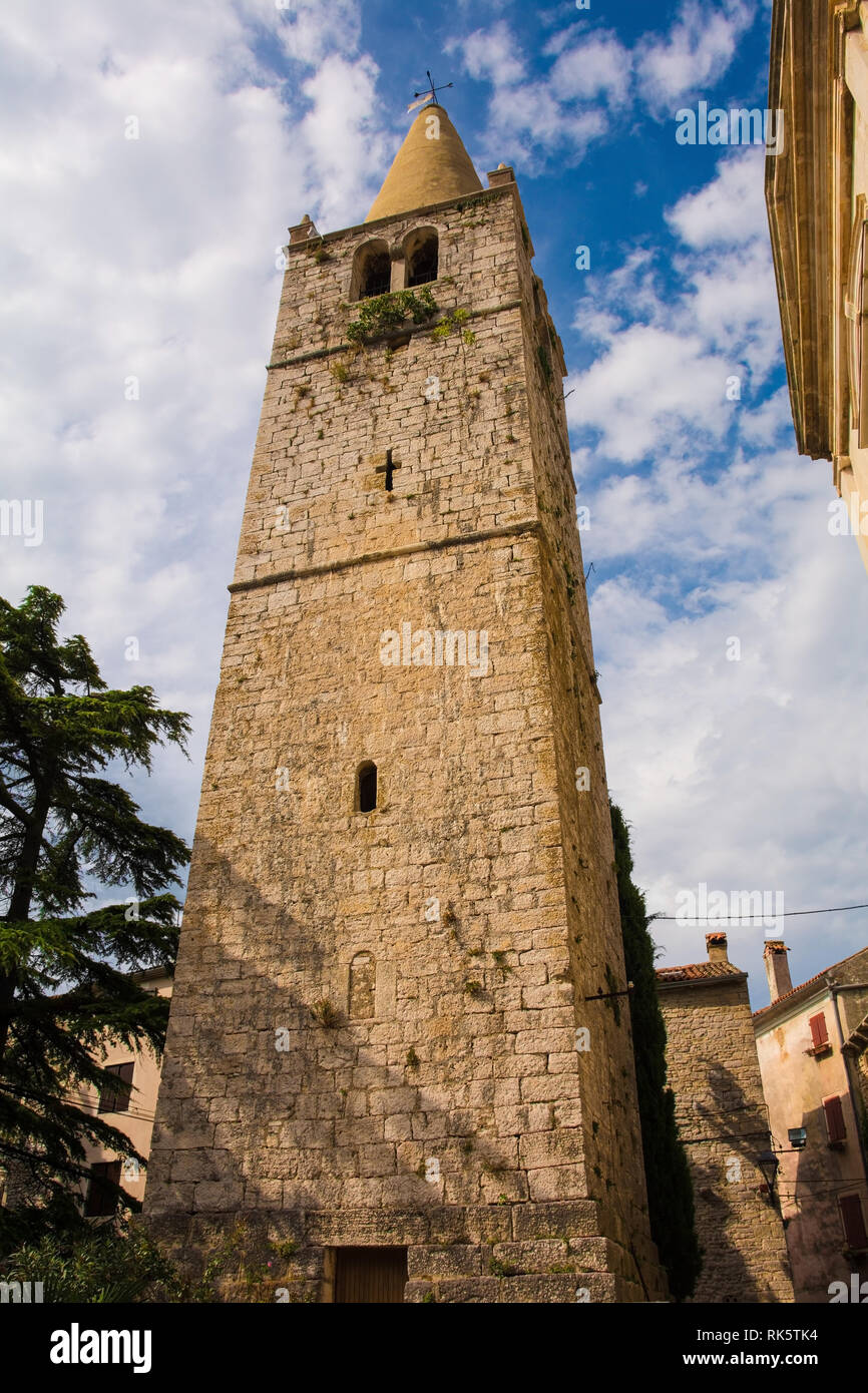 The historic bell tower of the Parish Church of Visitation of Blessed Virgin Mary to Saint Elizabeth in the Croatian hill village of Bale, also called Stock Photo