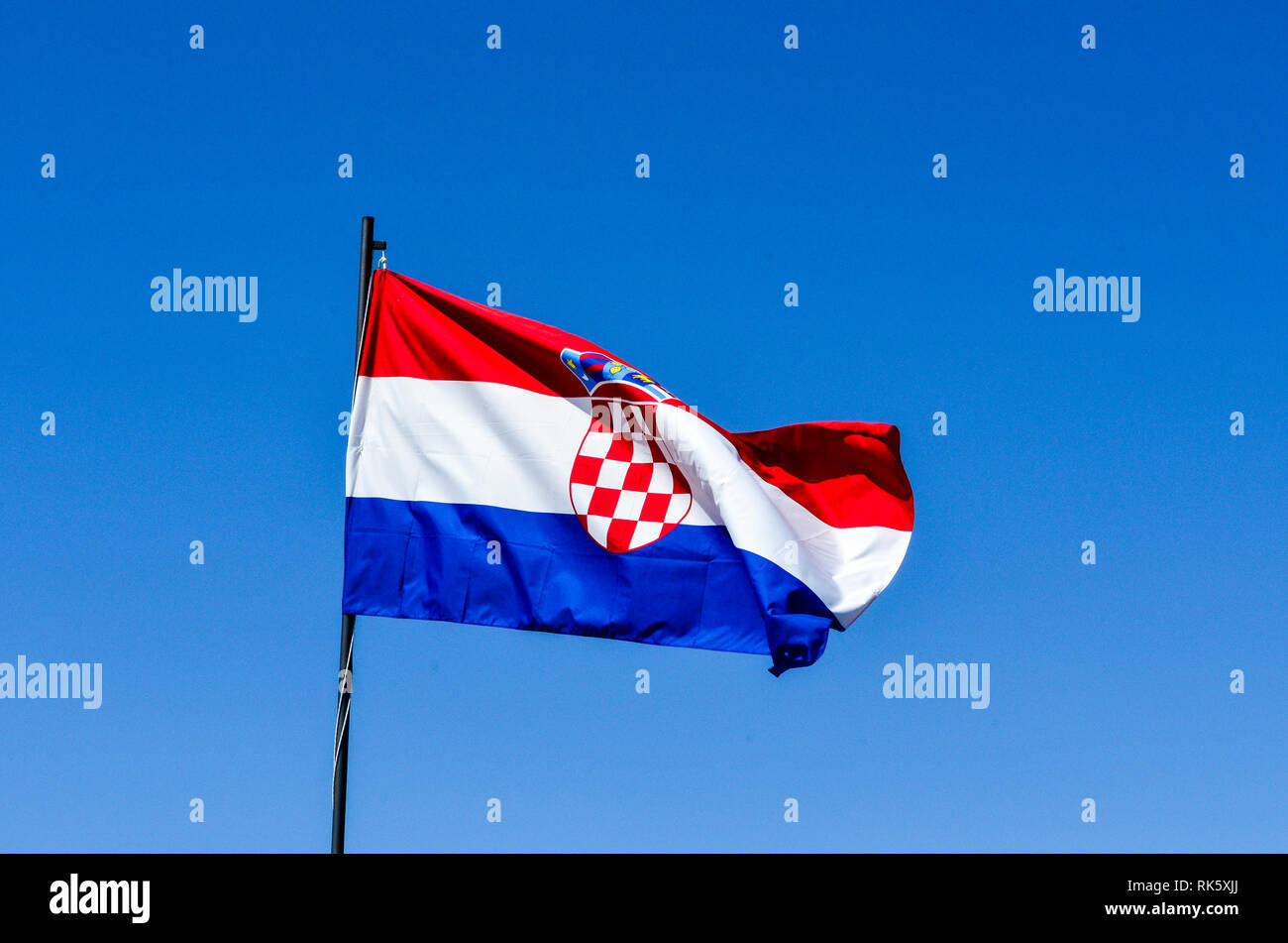 Croatian flag on a blue sky background Stock Photo