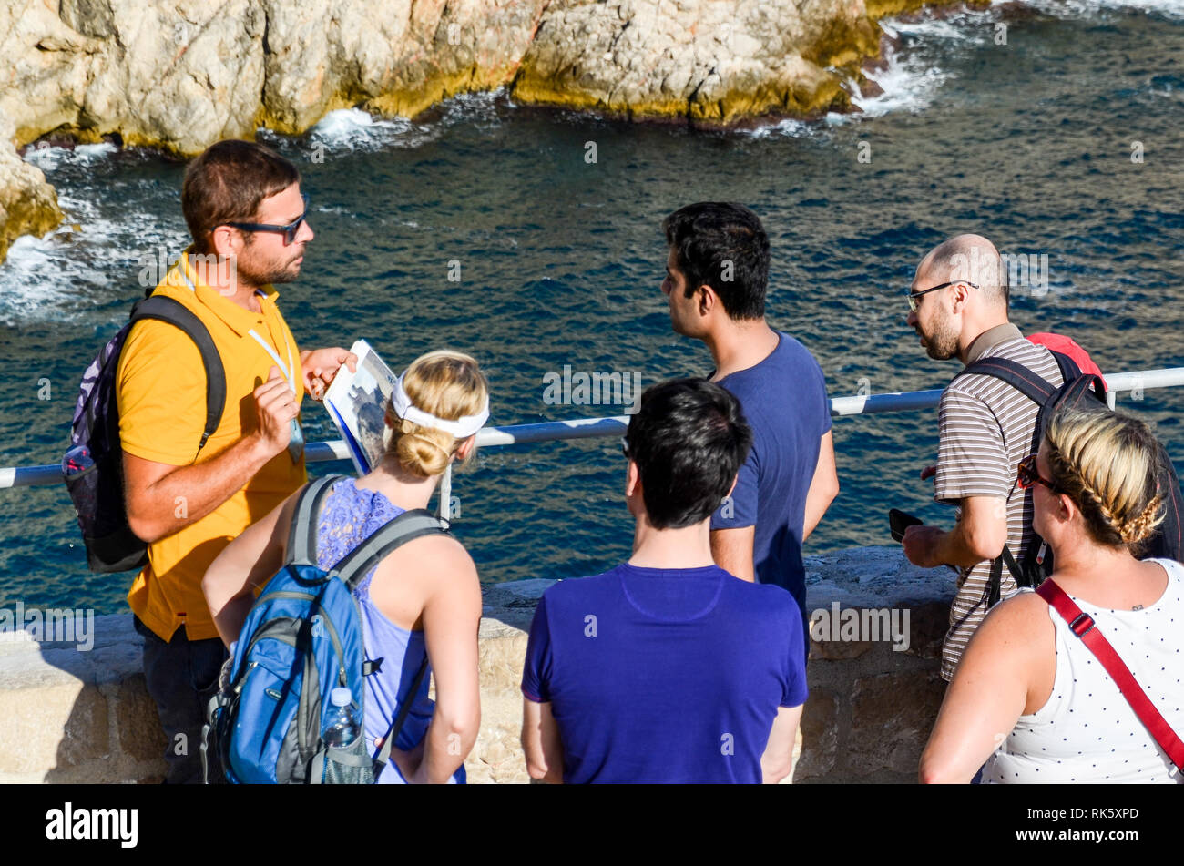 Mass tourism in Dubrovnik, Croatia: crowds of visitors join 'Game of Thrones' tours, exactly where the series were shot in the UNESCO heritage site Stock Photo