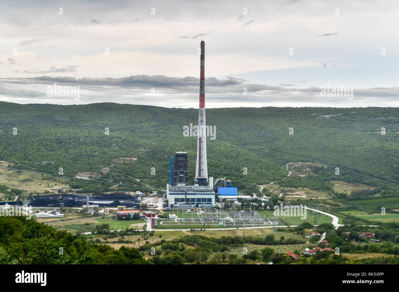 Plomin Power Station (Croatian: Termoelektránā Plòmīn) is a coal-fired power station near Plomin, Croatia, the 340m chimney is the tallest structure. Stock Photo