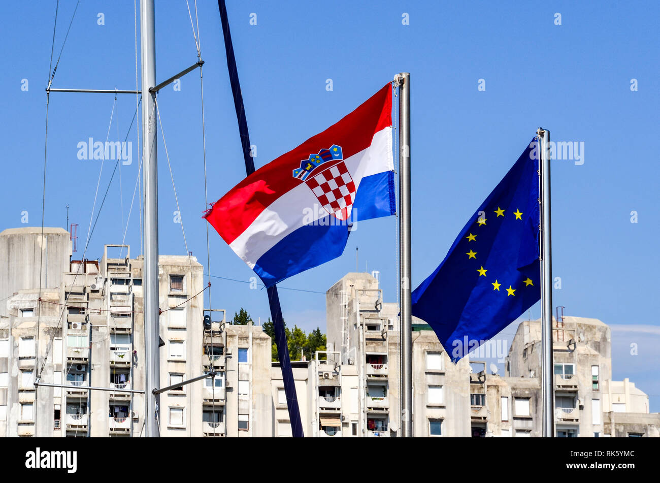 Croatian and European flags in the Coastal town of Ploce (Ploče), Croatia. It is the primary seaport used by Bosnia and Herzegovina. Stock Photo