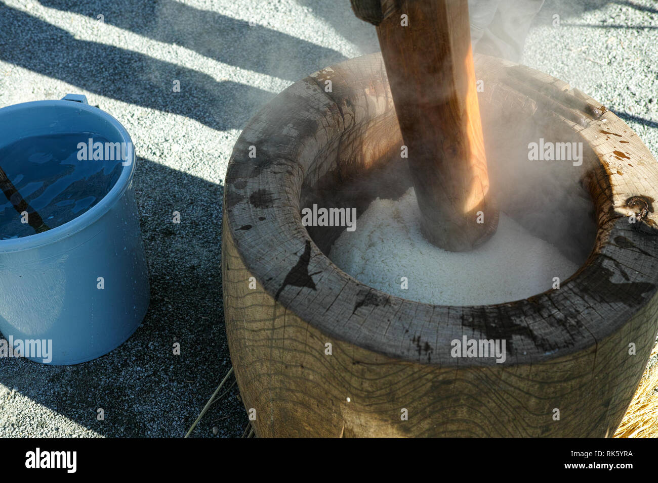 Preparing to pound the mochigome (rice used to make mochi) into mochi, a Japanese new year