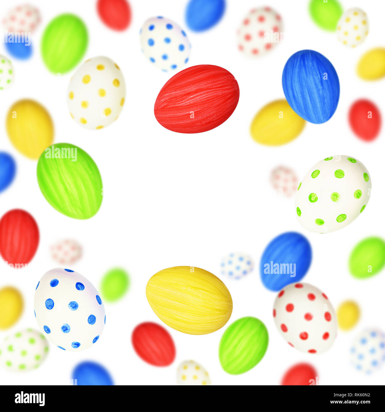 Colorful Easter eggs scattered on white background Stock Photo