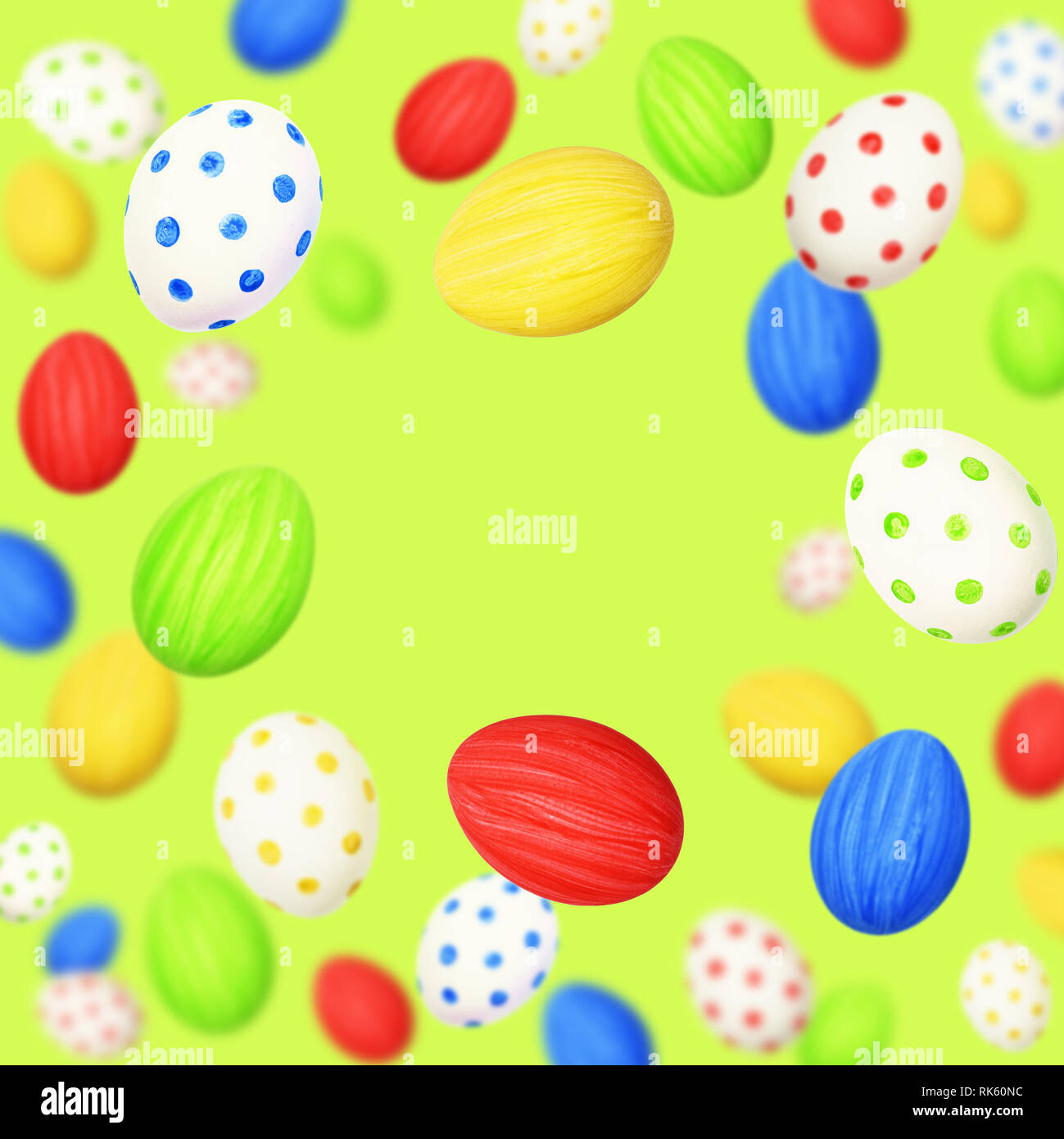 Cololrful Easter eggs scattered on green background Stock Photo