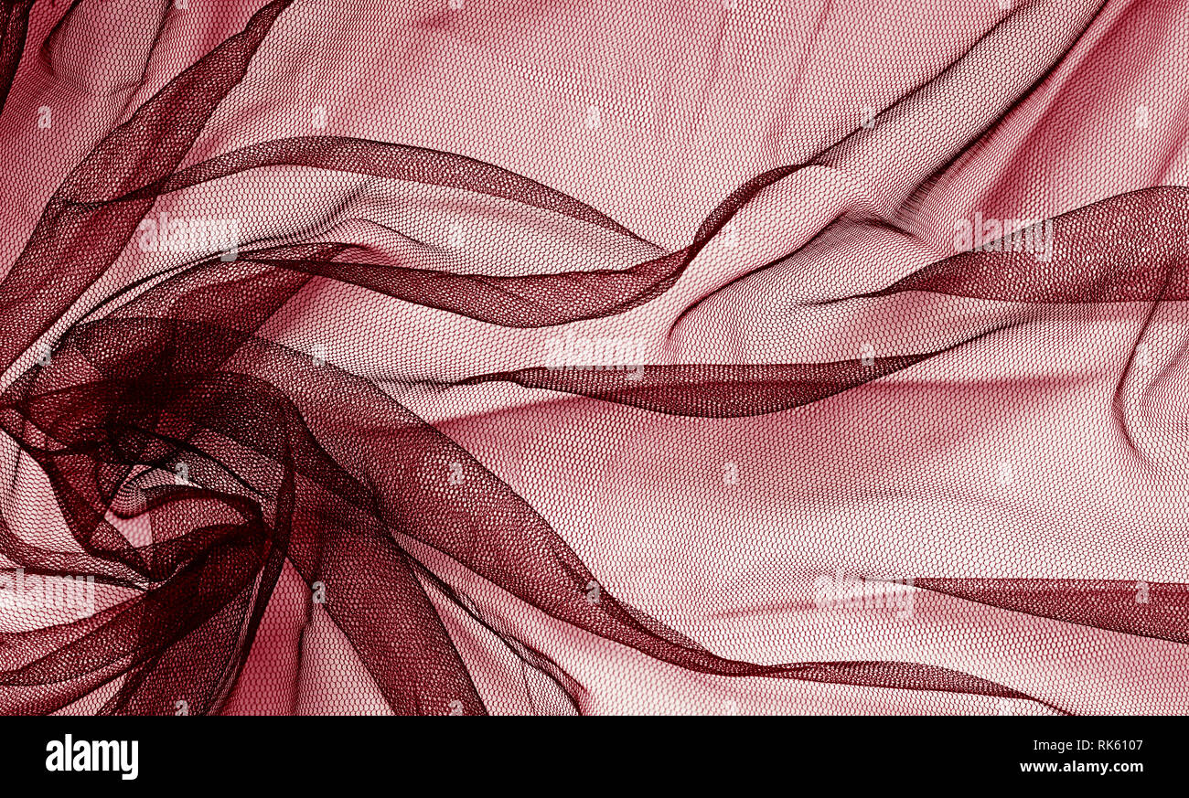 Red tulle background with drapery Stock Photo