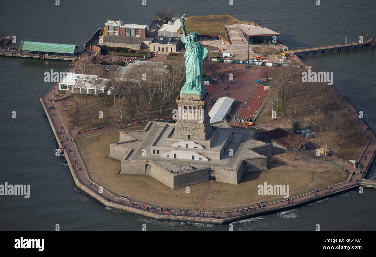 Statue of Liberty on Ellis Island, New York City, New York. Color daytime  landscape photo, statue is in center of frame, ample copy space in sky  Stock Photo - Alamy