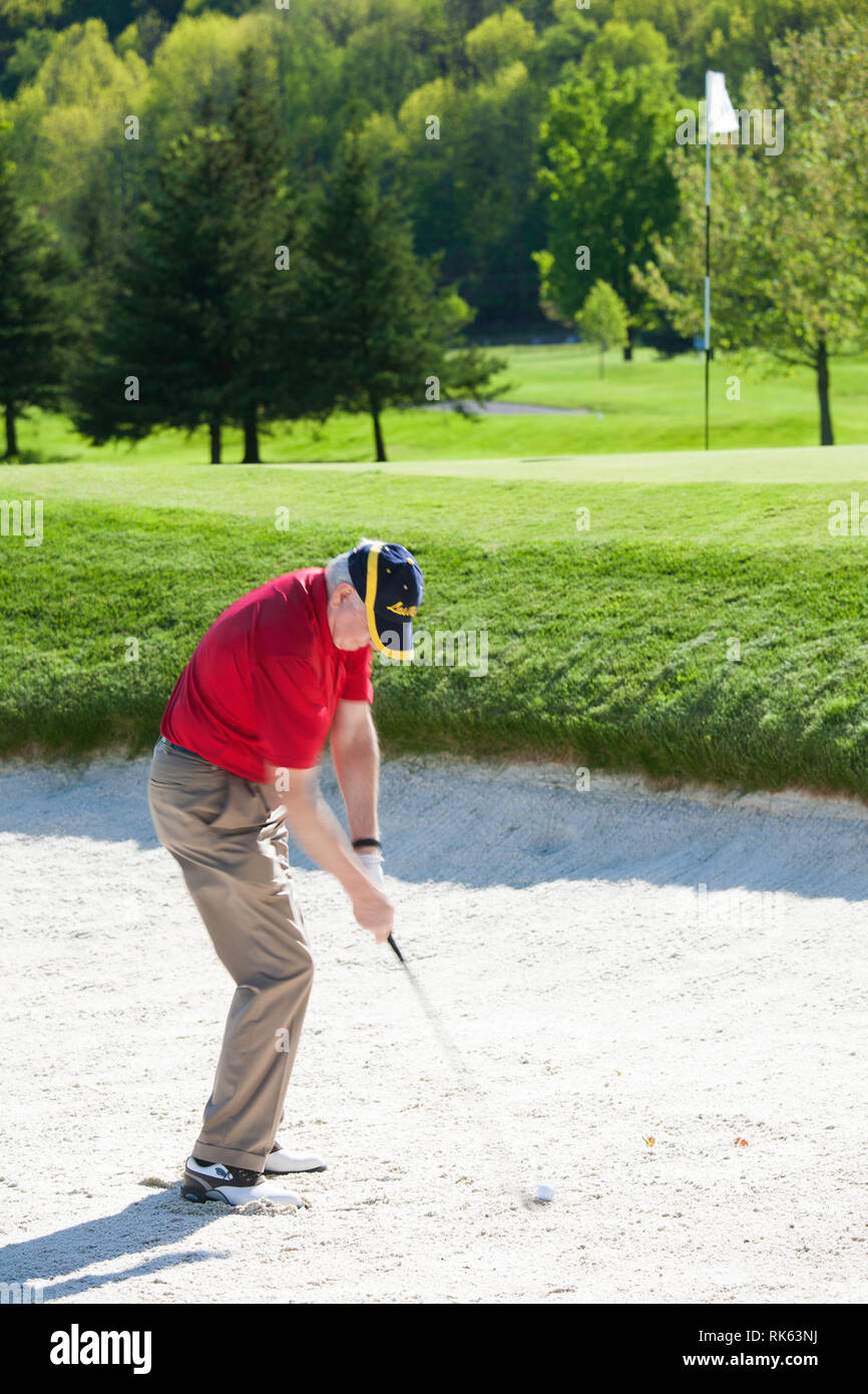 Mature Golfer in a Sand Trap, USA Stock Photo