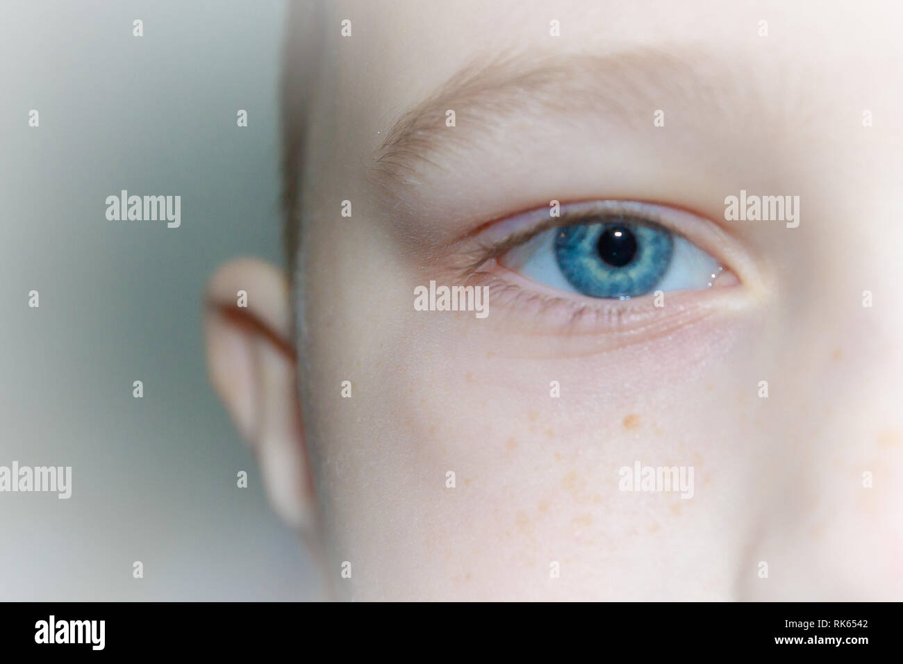 Baby blue beautiful, brooding eyes of a boy Stock Photo - Alamy