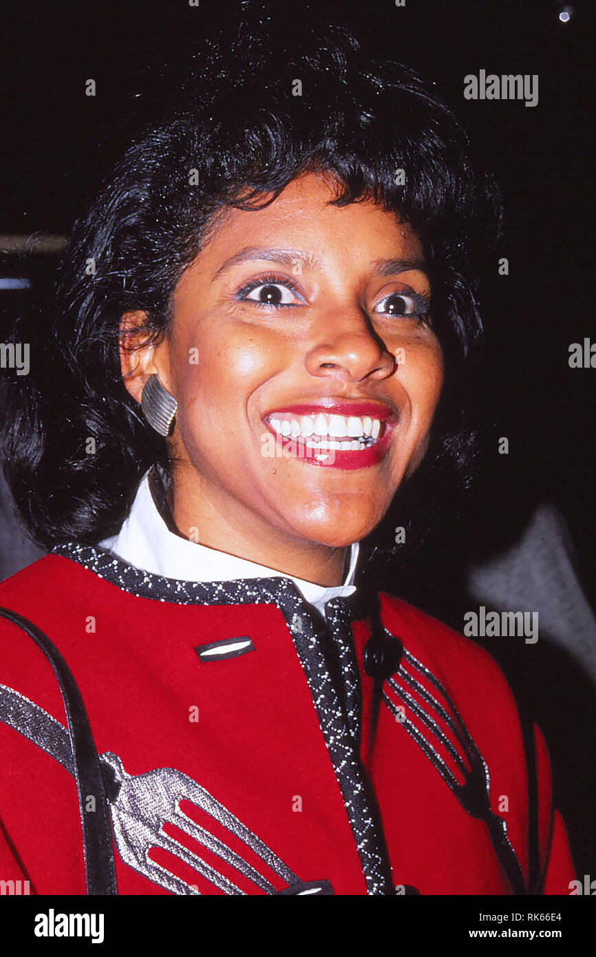 Phylicia Rashad wears a red coat whilst out and about in New York