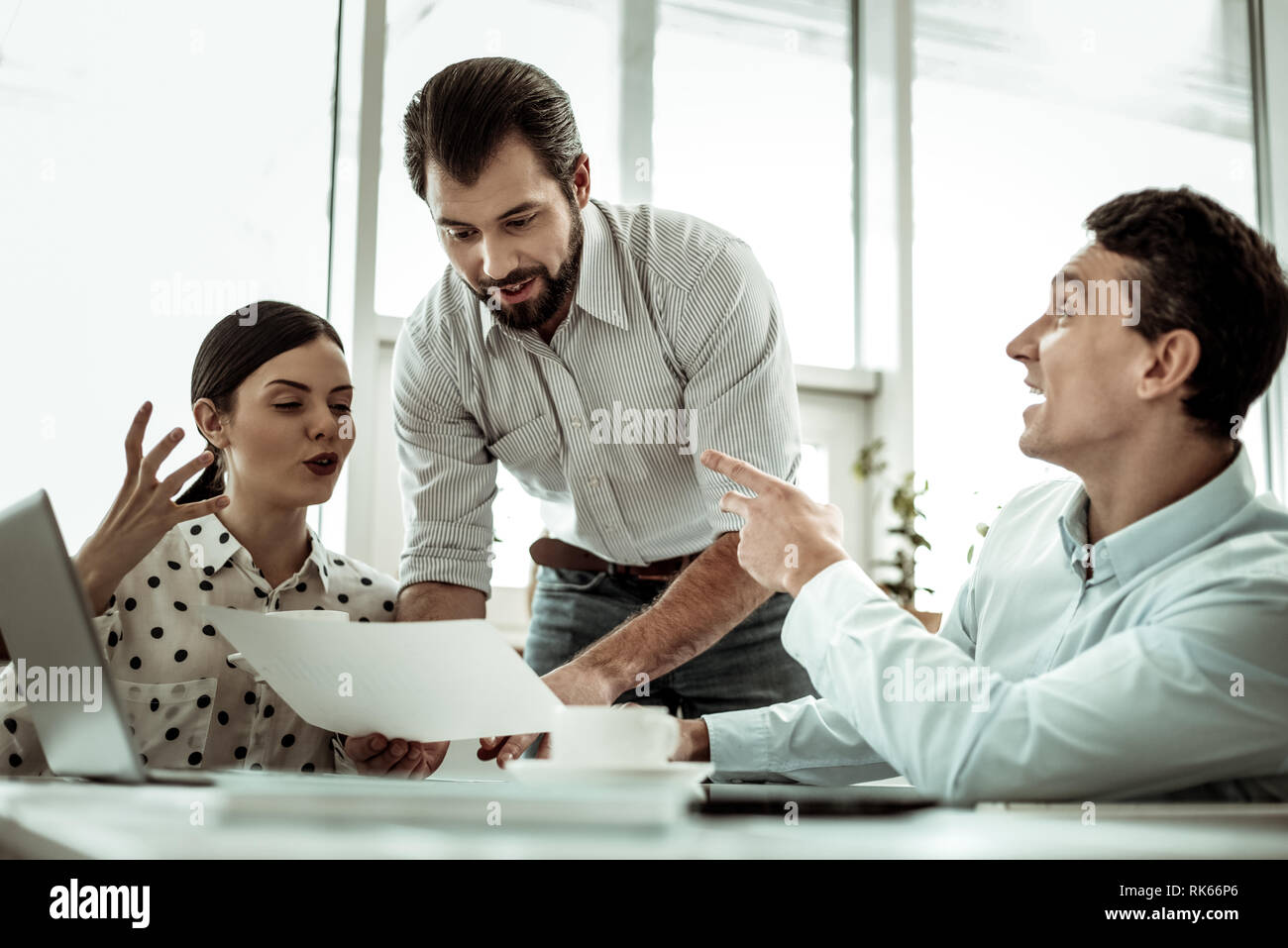 Positive delighted male person demonstrating his plan Stock Photo - Alamy