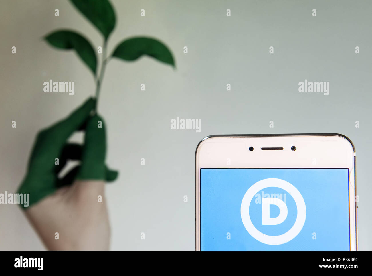 Hong Kong. 8th Feb, 2019. American liberal, progressive and left-wing democratic Party icon is seen on an Android mobile device depicting awareness of climate change in the background. Credit: Miguel Candela/SOPA Images/ZUMA Wire/Alamy Live News Stock Photo