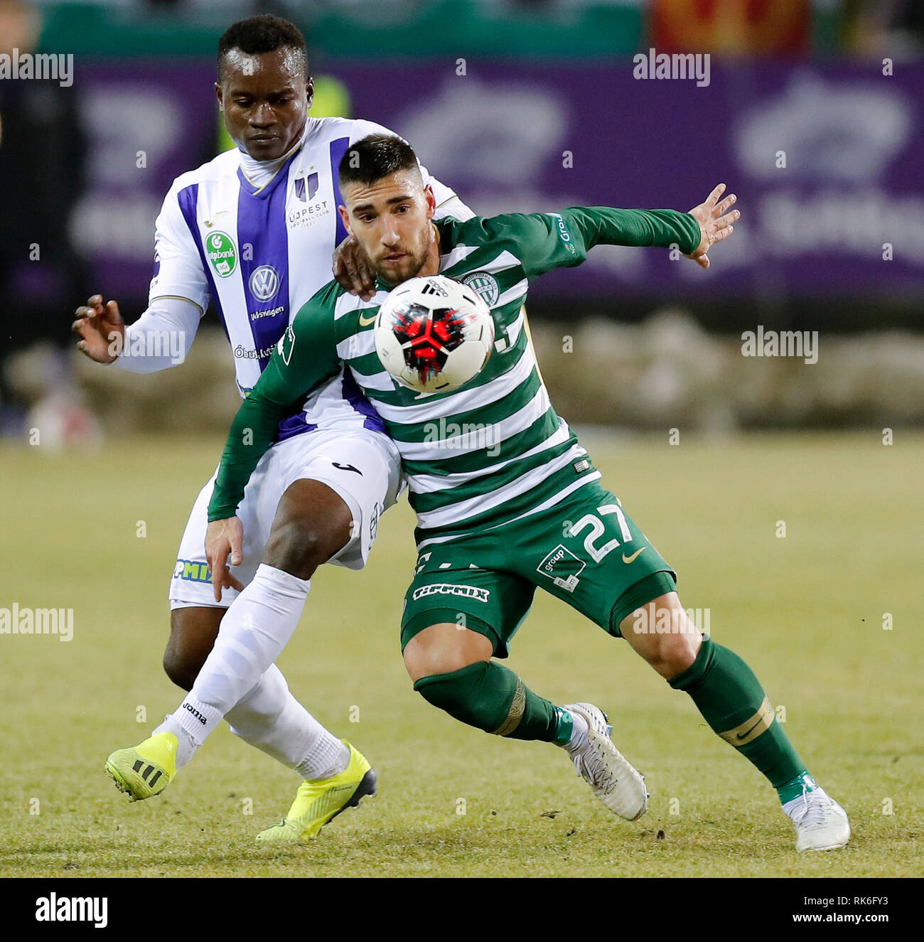 BUDAPEST, HUNGARY - MAY 27: (r-l) Endre Botka of Ferencvarosi TC challenges  Krisztian Simon of Ujpest FC during the Hungarian OTP Bank Liga match  between Ujpest FC and Ferencvarosi TC at Ferenc