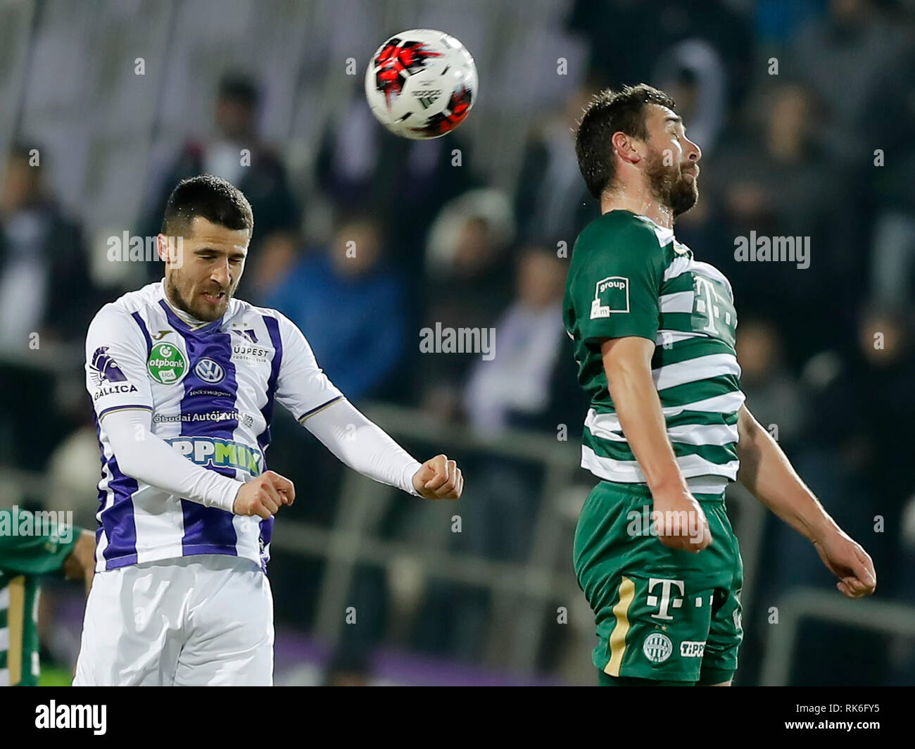 BUDAPEST, HUNGARY - MAY 27: (r-l) Endre Botka of Ferencvarosi TC challenges  Krisztian Simon of Ujpest FC during the Hungarian OTP Bank Liga match  between Ujpest FC and Ferencvarosi TC at Ferenc