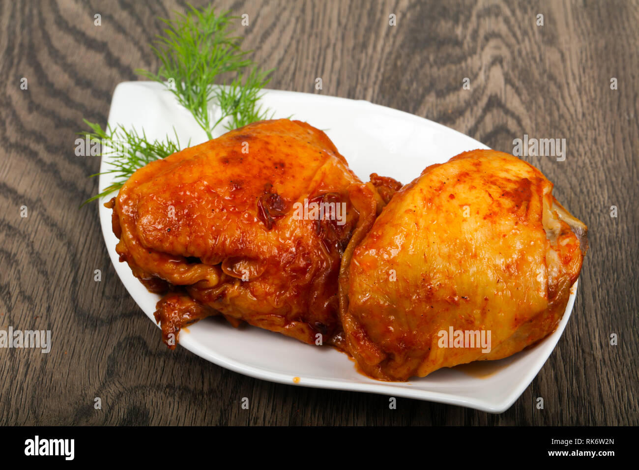 Roasted chicken thigh with tomato sauce Stock Photo Alamy
