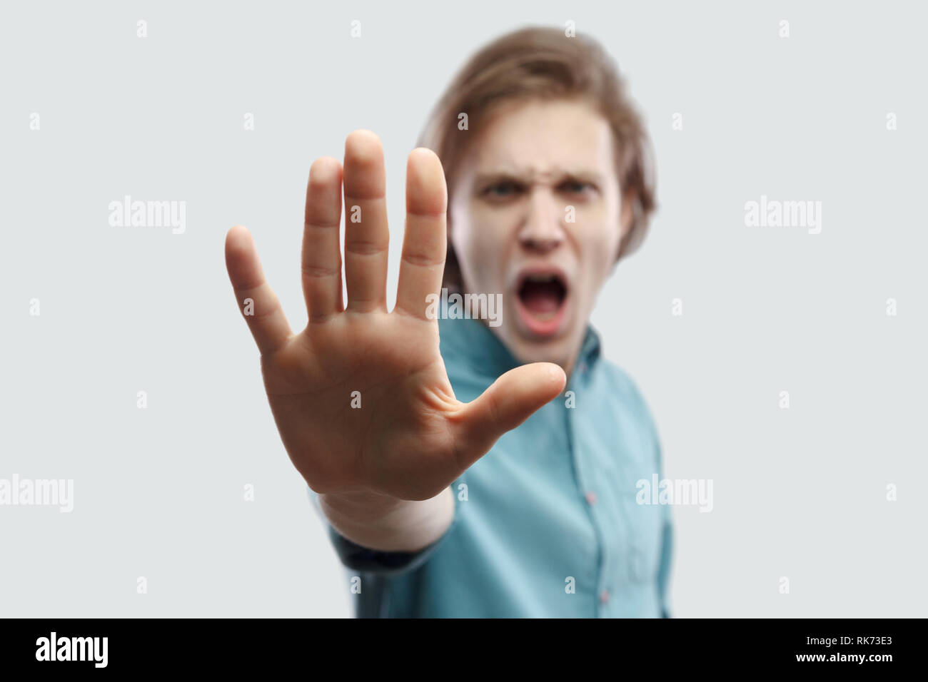 Stop It Portrait Of Angry Handsome Long Haired Blonde Man In Blue