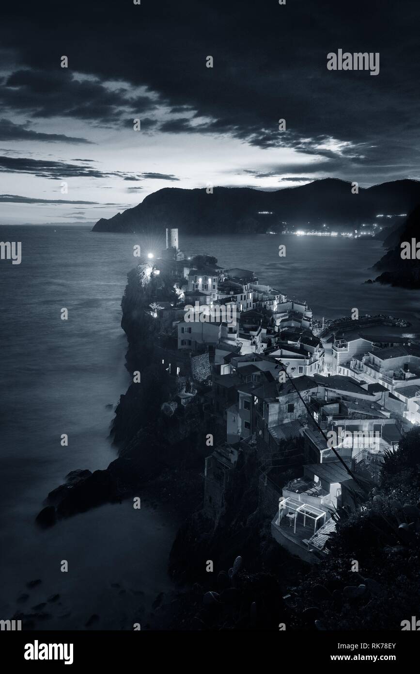 Vernazza at night with buildings on rocks over sea in Cinque Terre