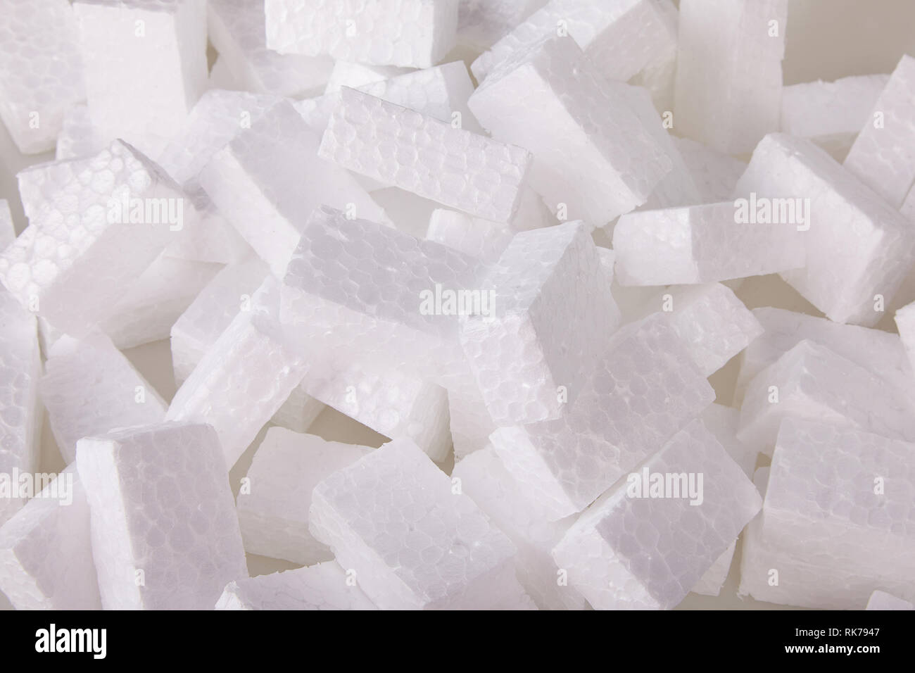 Filler packing background. Packaging foam pellets texture, top view, closeup. Polystyrene