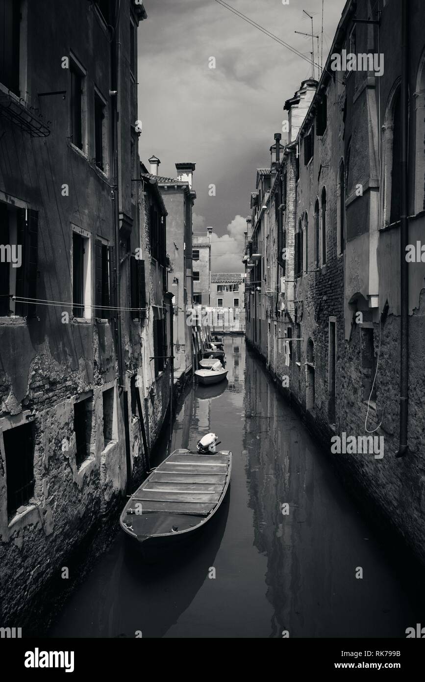 Boat park in Venice alley canal. Italy Stock Photo - Alamy