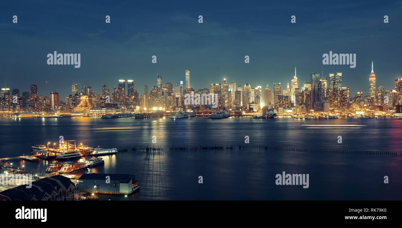 Midtown skyline over Hudson River in New York City with skyscrapers at ...