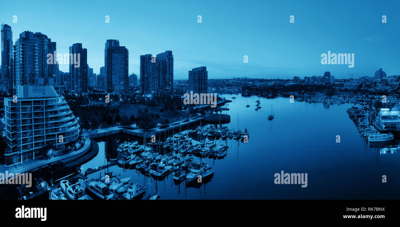 Vancouver harbor view with urban apartment buildings and bay boat in Canada Stock Photo Alamy
