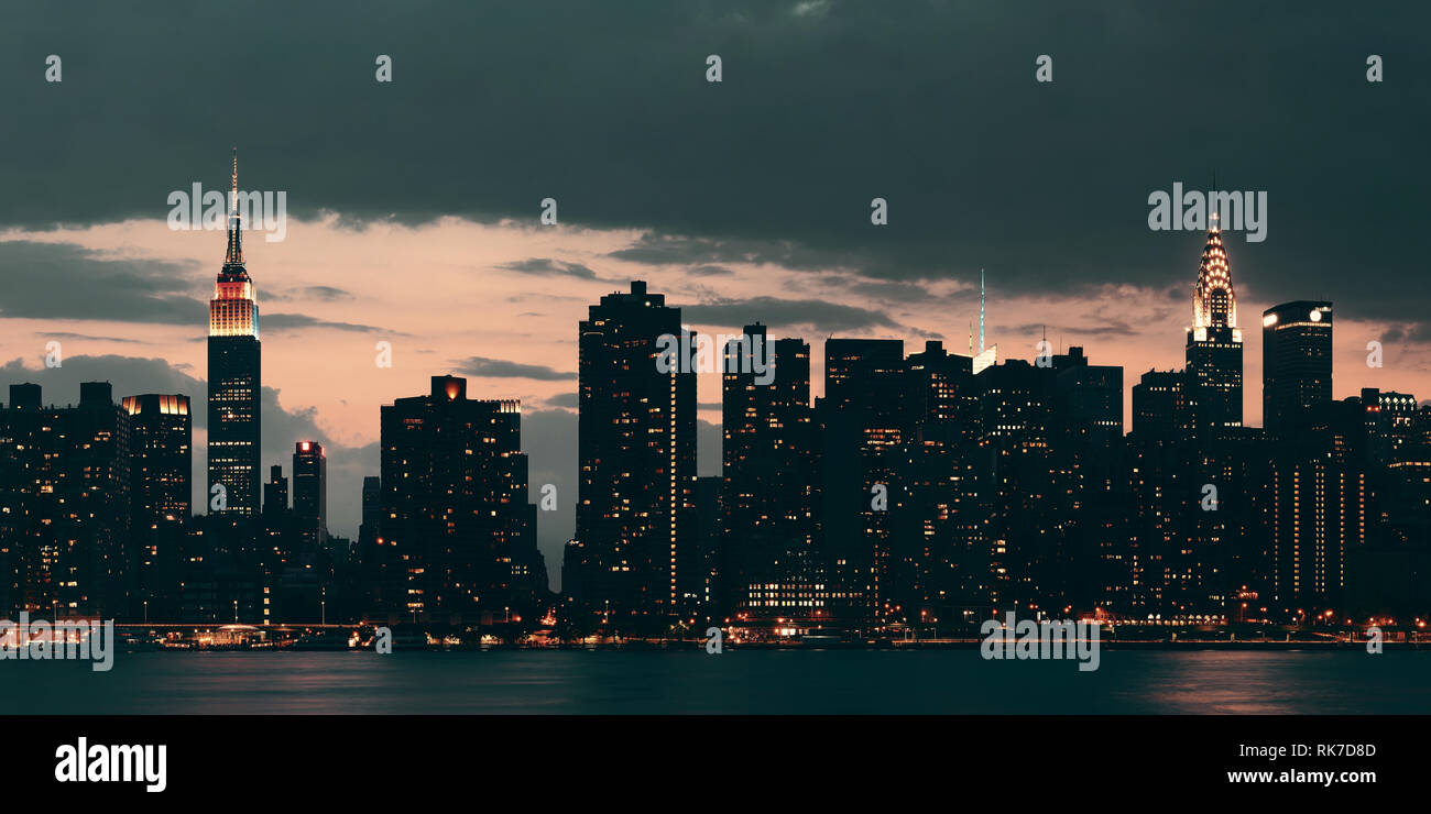 Midtown Manhattan skyline at dusk panorama over East River Stock Photo ...