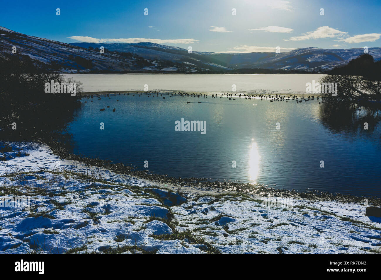 Semerwater in Winter. Semerwater  is the second largest natural lake in North Yorkshire, England, after Malham Tarn. It is half a mile long. Landscape Stock Photo