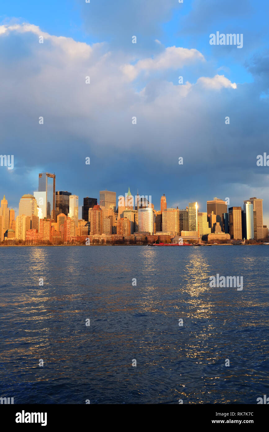 Downtown Manhattan skyline at sunset over Hudson River in New York City ...