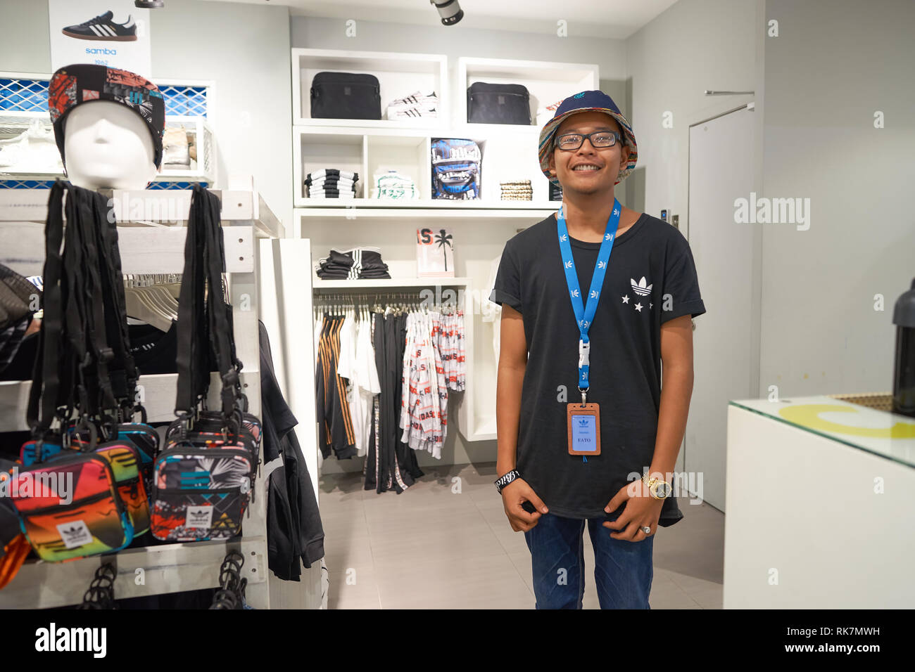 KUALA LUMPUR, MALAYSIA - MAY 09, 2016: portrait of seller in Adidas store  in Suria KLCC. Suria KLCC is a shopping mall is located in the Kuala Lumpur  Stock Photo - Alamy