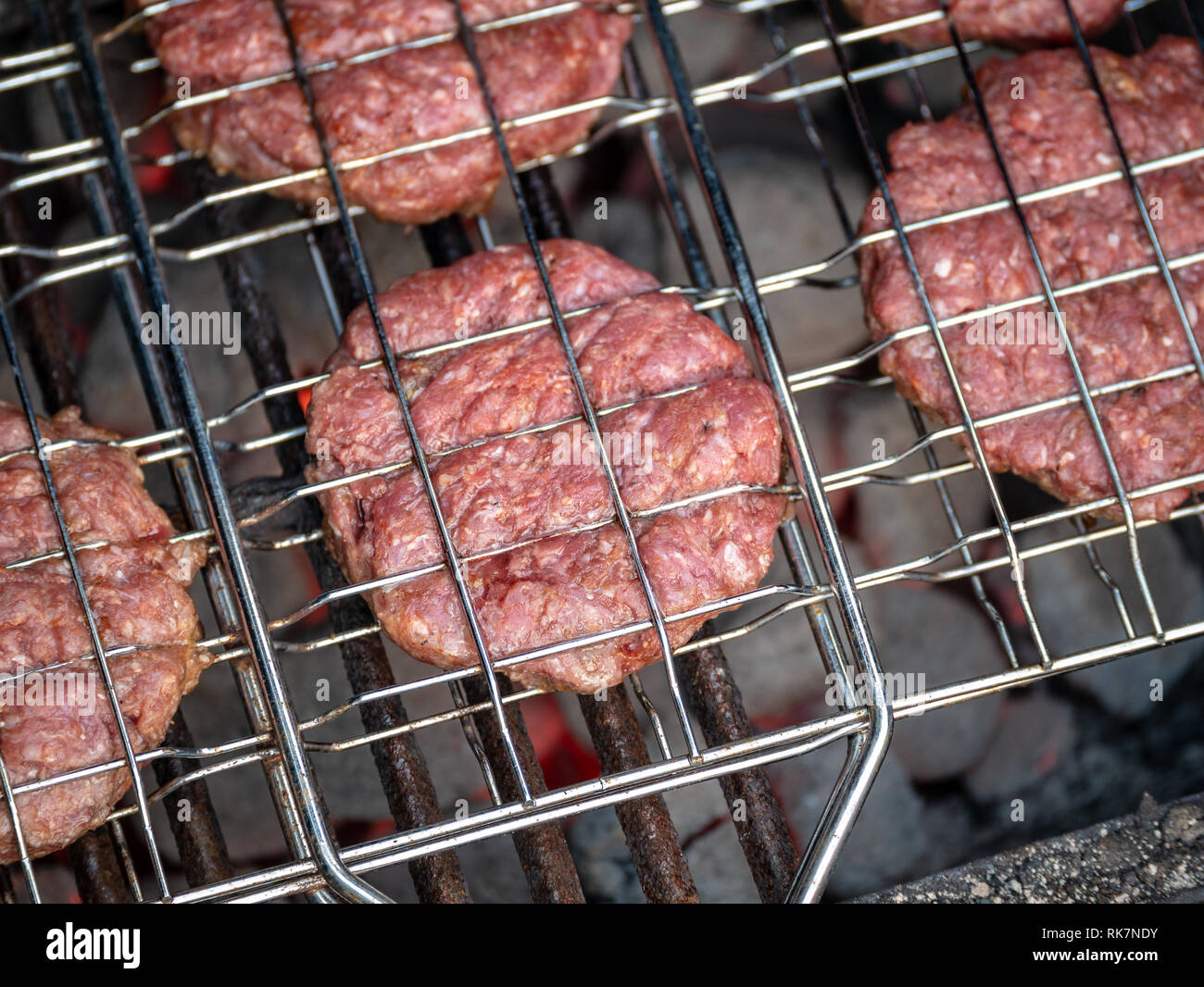 Image of bbq burger patties on grill Stock Photo