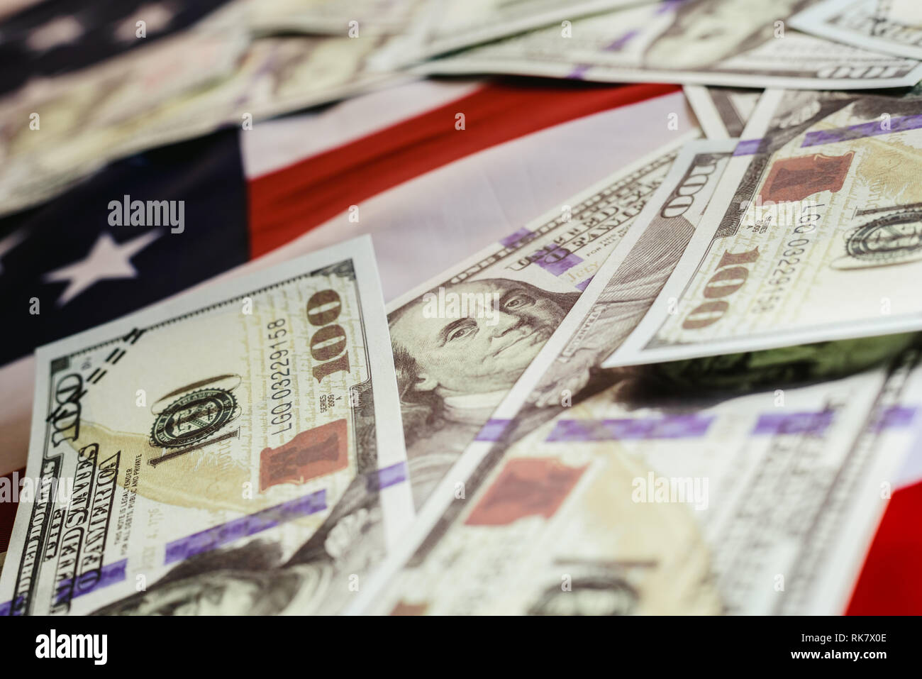 Stack of 100 dollar bills on american flag Stock Photo - Alamy