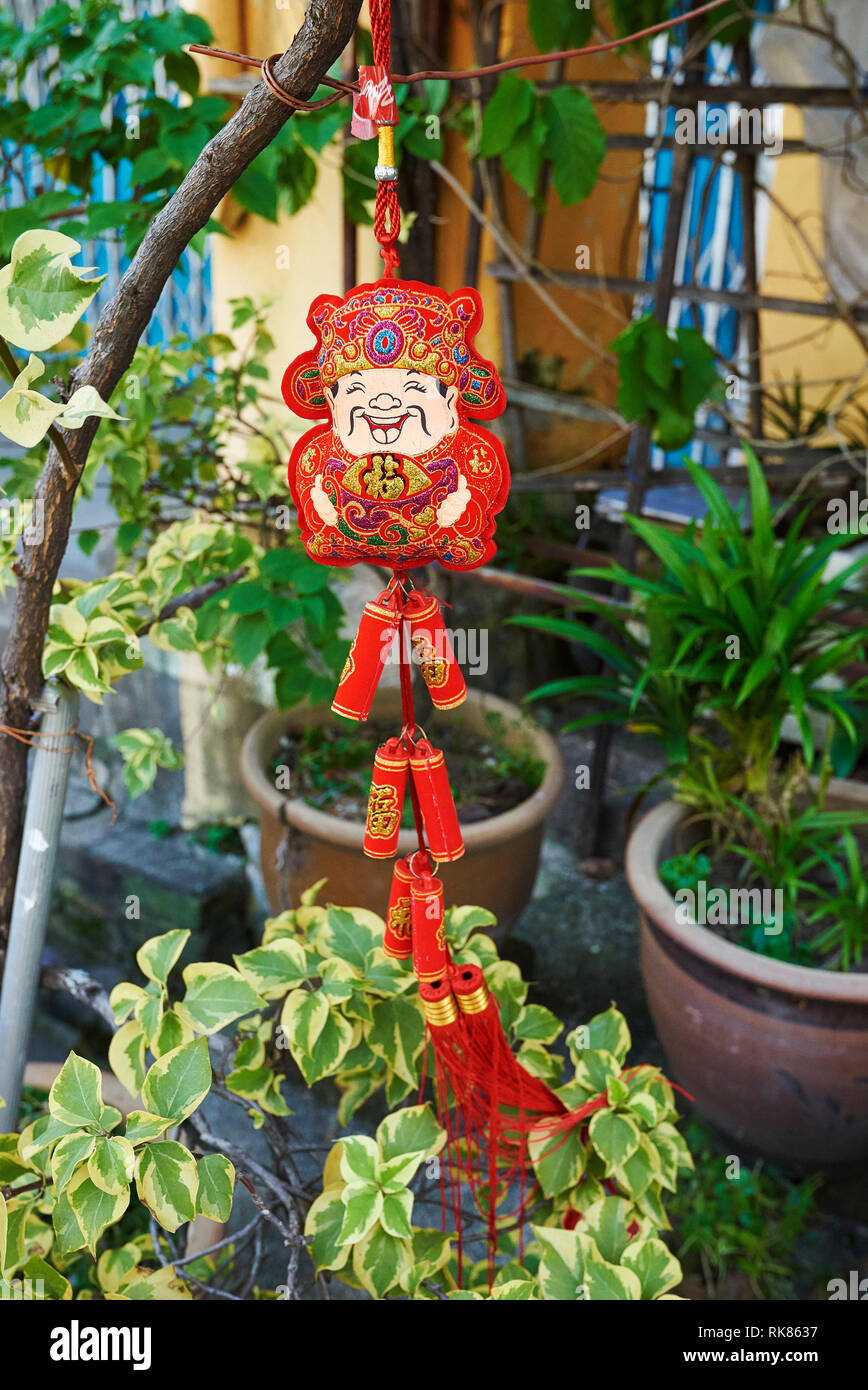 petards hanging in plants for Chinese New Year celebration in George Town, Penang, Malaysia Stock Photo
