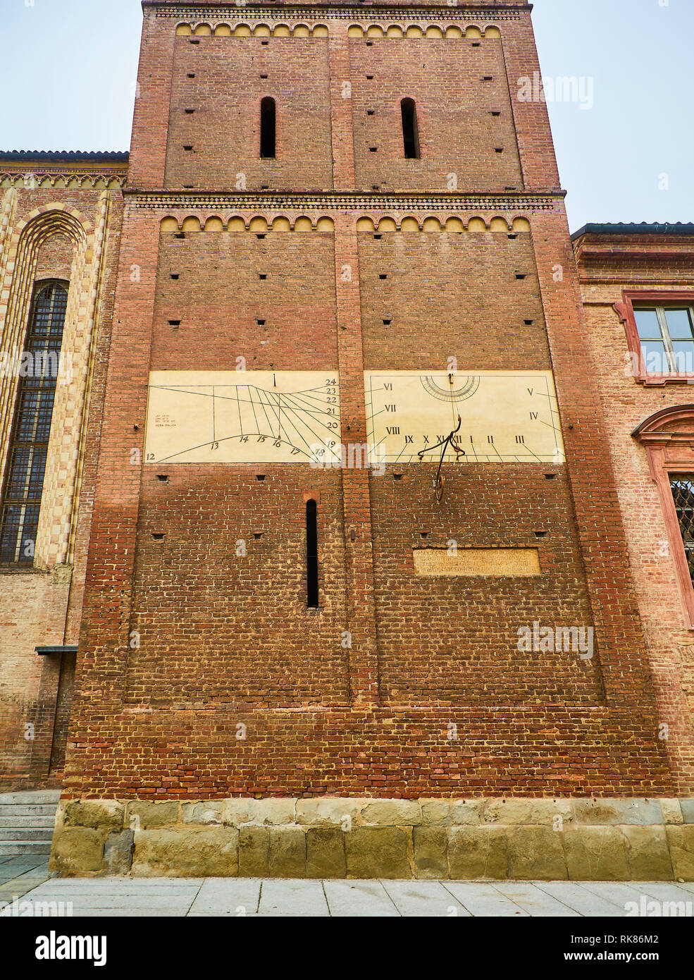 Sundial on the lateral facade of The Cattedrale di Santa Maria Assunta e San Gottardo, Asti Cathedral. View from the Piazza Cattedrale square. Asti. Stock Photo
