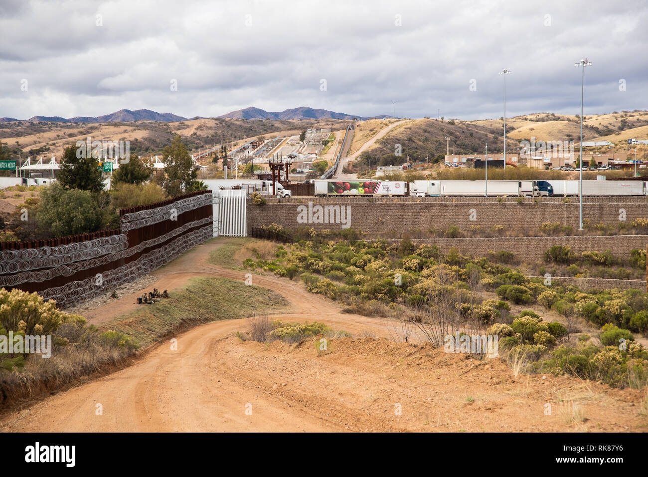 The U.S. Mexico border near Nogales covered with multiple layers of concertina wire on the