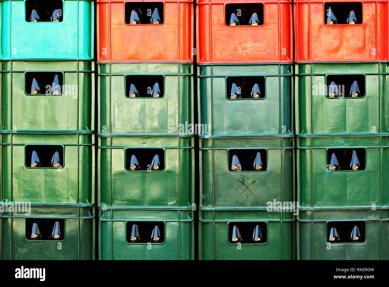 Full frame of plastic colorful beer crates stacked one upon the other Stock Photo