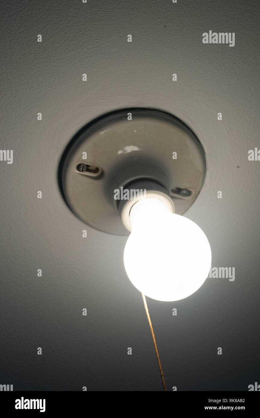 A light bulb illuminates a ceiling Stock Photo Alamy