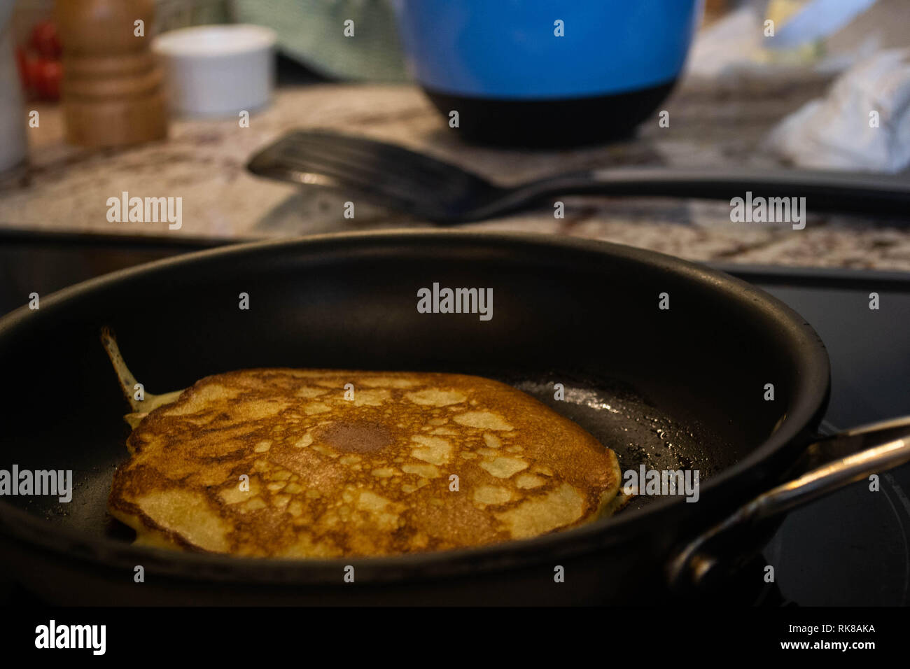 Sourdough pancakes frying in a nonstick teflon pan Stock Photo