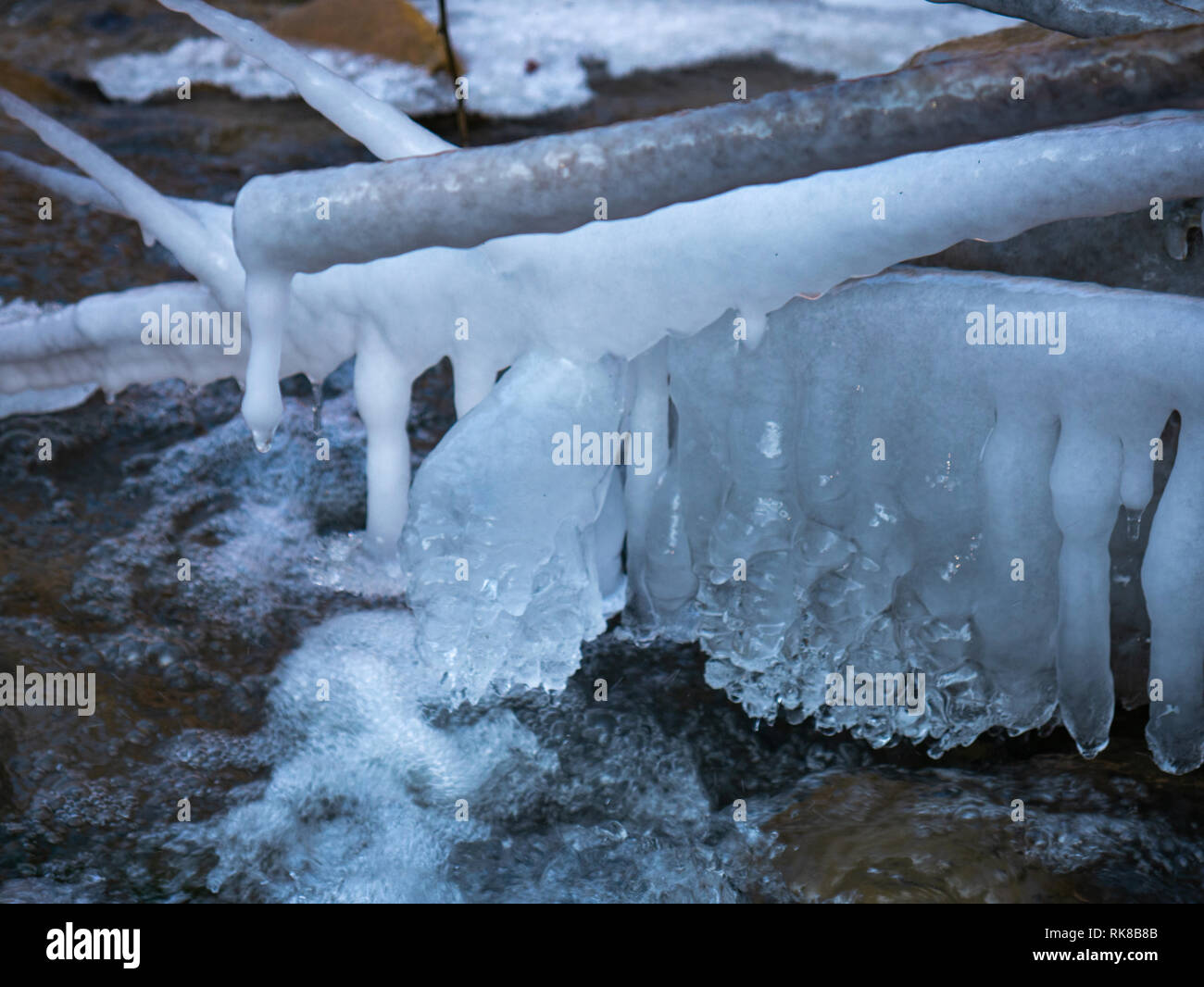 A frozen waterfall in winter in a little river Stock Photo - Alamy