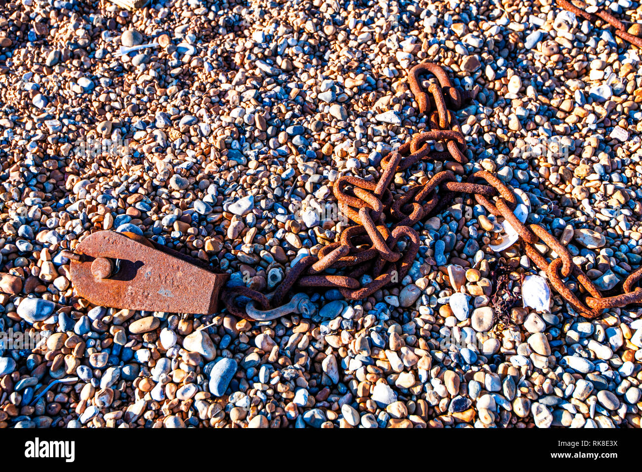 Iron Chain Background Poster - the chain used to attach the bulldozer which pulls or pushes the Hastings Fishing Fleet to and from the sea Stock Photo