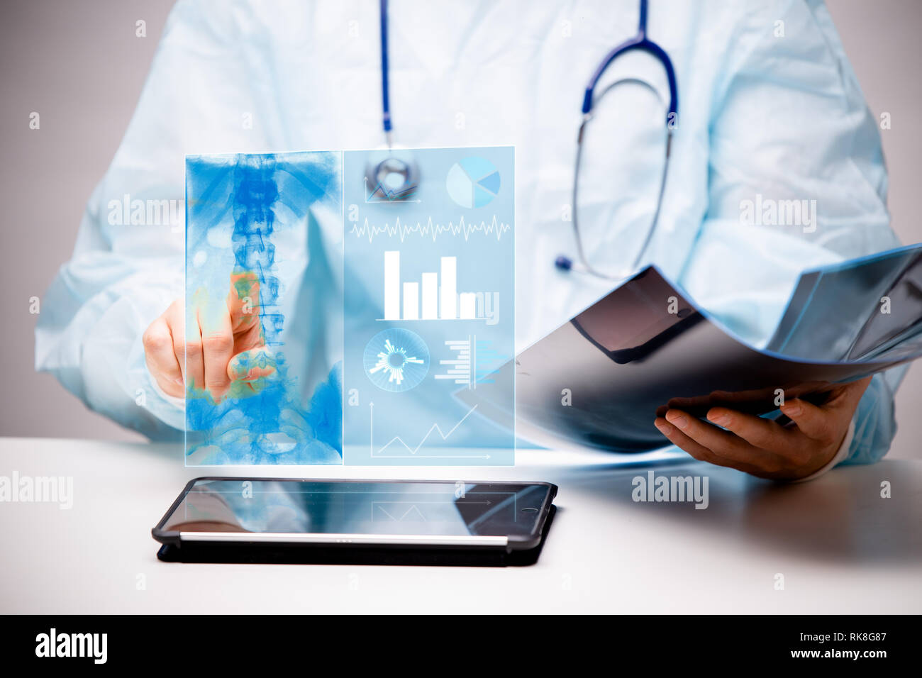 Doctor interacts with virtual screen of new technology for medicine