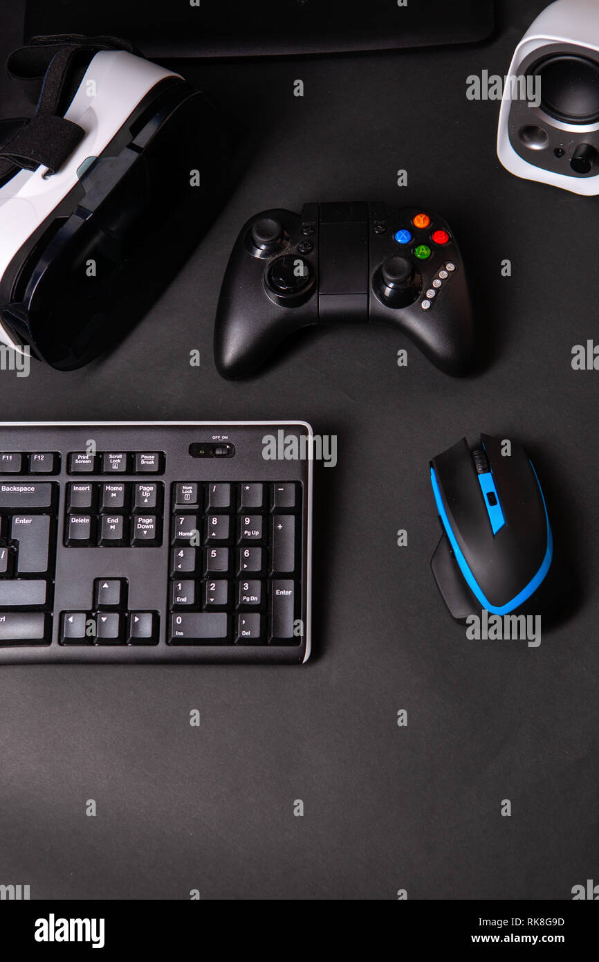 Top view a gaming gear, mouse, keyboard, joystick, headset, VR Headset on  black table background Stock Photo - Alamy
