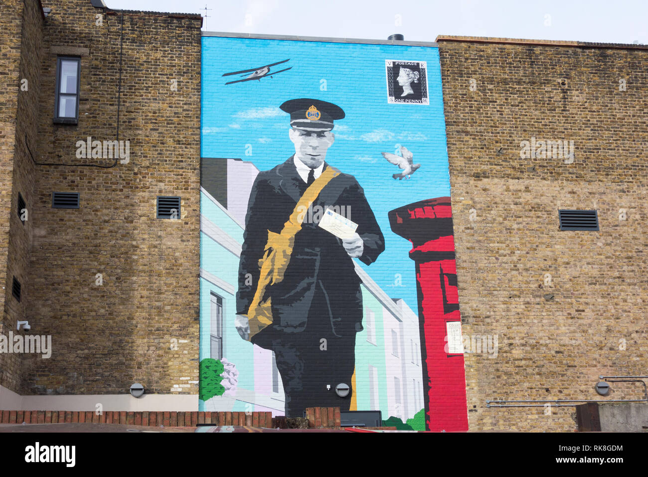 A Postman painted on a wall outside the The Mount Pleasant Mail Centre Museum, Farringdon Road, London, EC1, UK Stock Photo