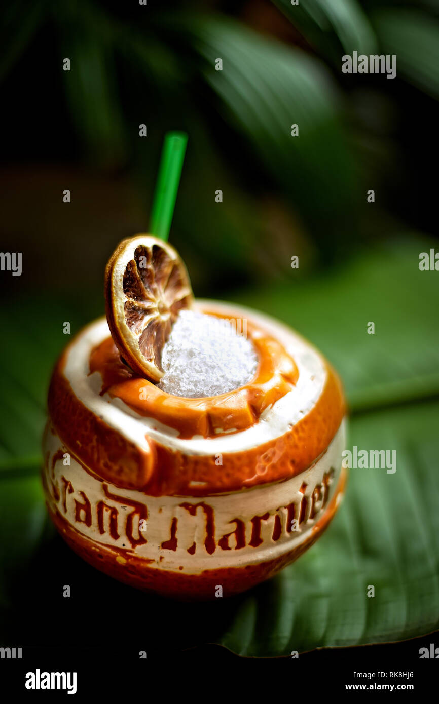 Vertical photo of a Tiki cocktail served in a Grand-Marnier cup Stock Photo