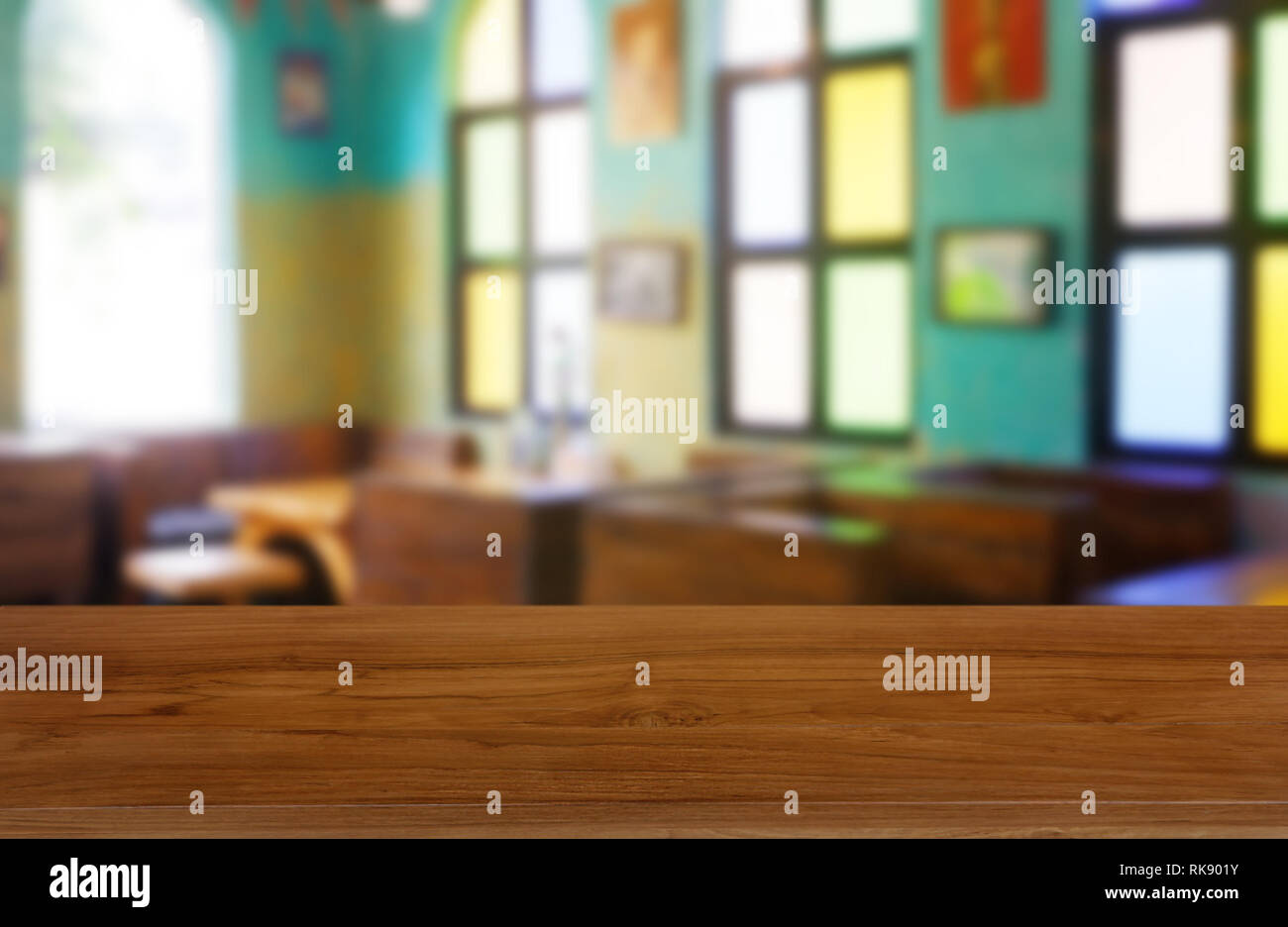 Empty wooden table in front of abstract blurred background of ...