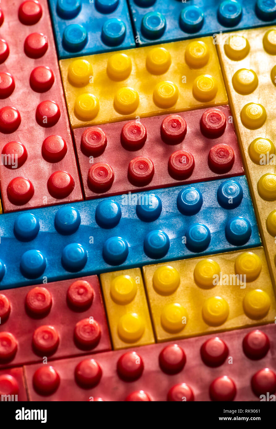 Plastic geometric cubes. Construction toy solid background from designer constructor. Multi-colored cubes. Geometric background. Children's toy. Circl Stock Photo